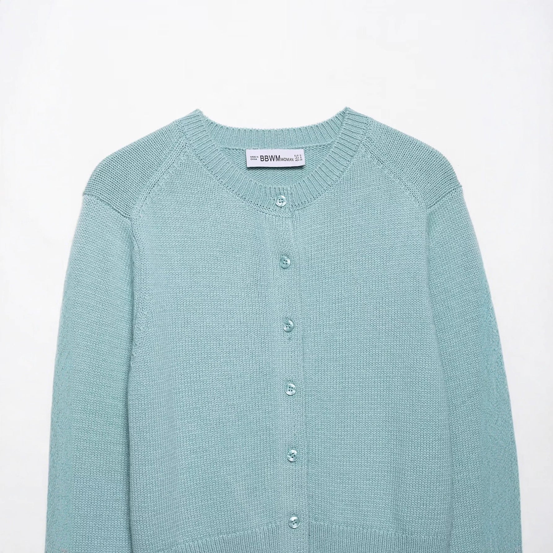 Round neck single breasted solid color knitted sweater top for women